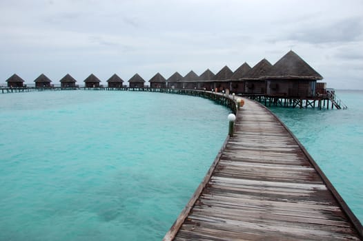 Timber pathway to bungalow at Thulhagiri Island Resort, Maldives