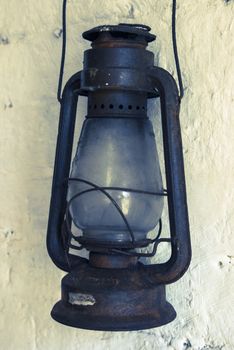 An old rusty kerosene lamp in a museum
