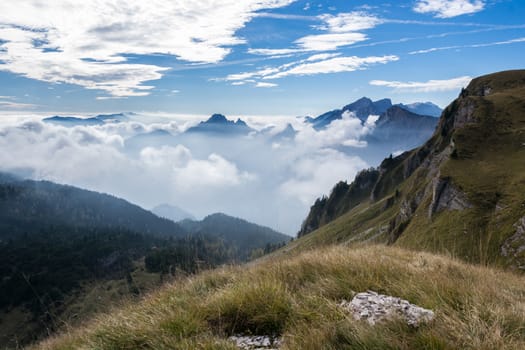 Italian dolomites during a sunny day with a sea of clouds