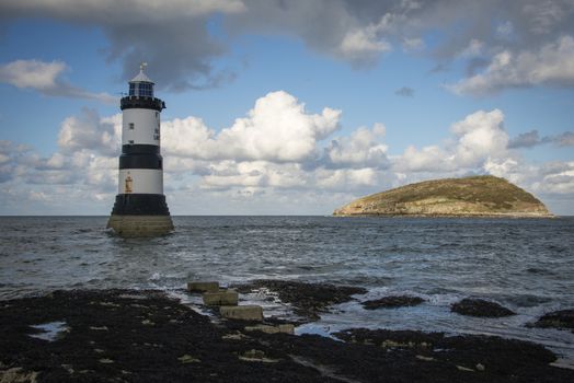Penmon Lighthouse and Puffin Island at Penmon Point, Anglesey, North Wales