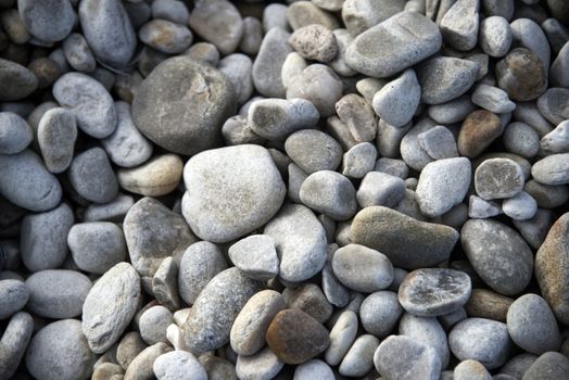 Close up of grey pebbles on a beach