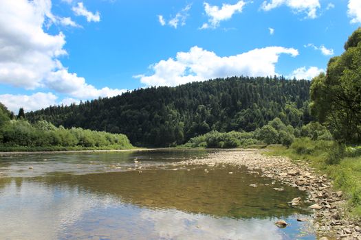 beautiful landscape with speed river in Carpathian mountains