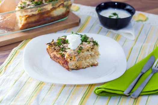 Cauliflower baked with eggs, cheese and dill on top
