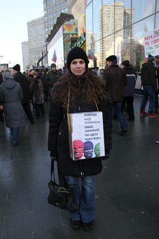 Moscow, Russia - March 10, 2012. Civil activist raises funds in support of the arrested Pussy Riot on an opposition rally on election results