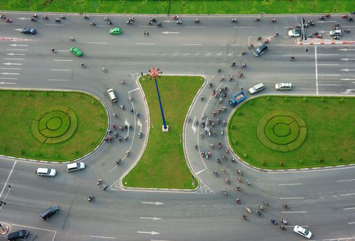 HO CHI MINH CITY, VIETNAM- MAY 9: Abstract scene of traffic in city on day, vehicle as motorbike, car moving cross crossroad, development of traffic infrastructure of Viet Nam, May 9, 2014