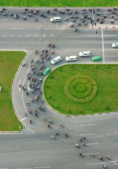 HO CHI MINH CITY, VIETNAM- MAY 9: Abstract scene of traffic in city on day, vehicle as motorbike, car moving cross crossroad, development of traffic infrastructure of Viet Nam, May 9, 2014