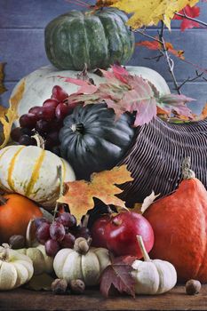 Retro or vintage image of a Cornucopia or Horn of Plenty with lots of fresh vegetables and fruit spilling out.