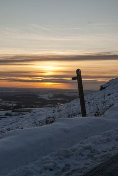 Scenic snowy view from Ramshaw Rocks, Peak District, looking towards Leek, Staffordshire