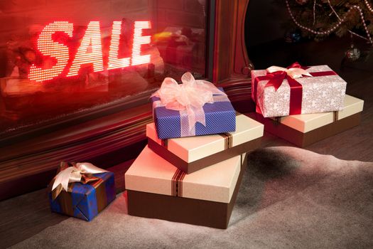 New Year's sale of gifts in shop, boxes packed by tapes and bows