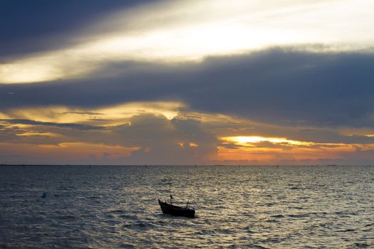 Silhouette of boats at sea during sunset