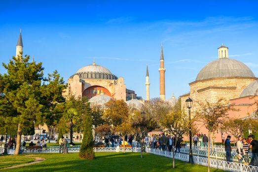 ISTANBUL, TURKEY - SEPTEMBER 14, 2014: Tourists walk in Sultanahmet Square. More than 10 million people visit the city every year.