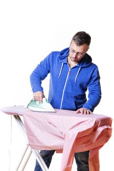 Man doing housework and ironing a shirt