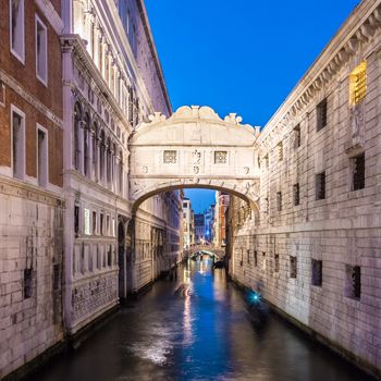 Gondolas passing under Bridge of Sighs, Ponte dei Sospiri. A legend says that lovers will be granted eternal love if they kiss on a gondola at sunset under the Bridge. Venice,Veneto, Italy, Europe. 