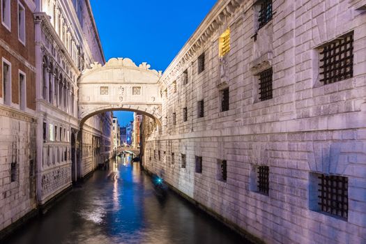 Gondolas passing under Bridge of Sighs, Ponte dei Sospiri. A legend says that lovers will be granted eternal love if they kiss on a gondola at sunset under the Bridge. Venice,Veneto, Italy, Europe. 