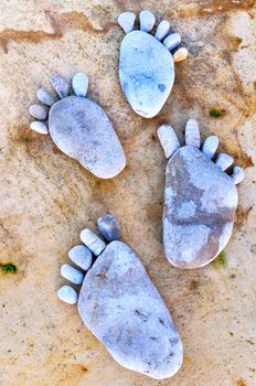 Footsteps of a pebbles on the rocky beach