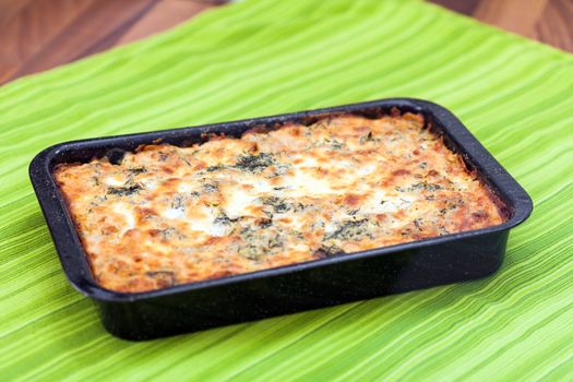 Cauliflower baked with eggs, cheese and parsley on top