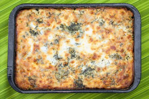 Cauliflower baked with eggs, cheese and parsley on top