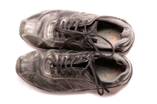 Some old Sneakers semi isolated on white background.