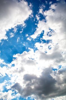 A blue sky with some fluffy clouds.