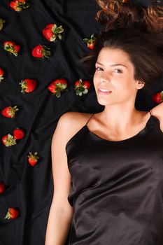 A young adult american woman dreaming of strawberries.
