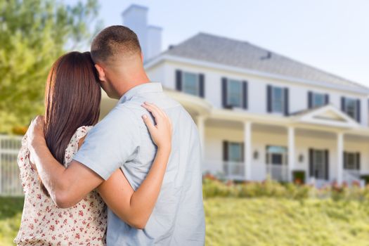 Affectionate Military Couple Looking at Nice New House.