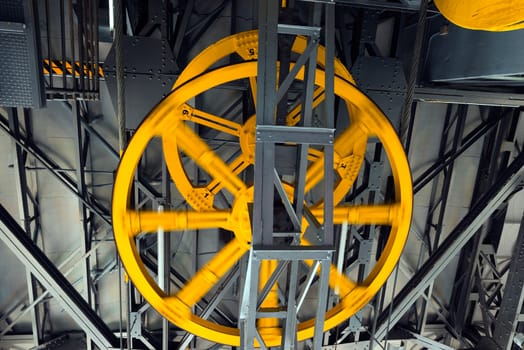 Mechanism of a funicular with yellow wheels one in motion