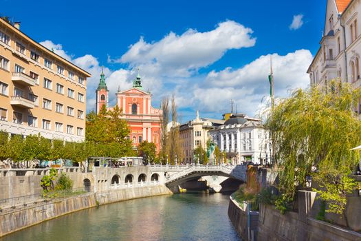 Romantic Ljubljana city center. River Ljubljanica, Triple Bridge - Tromostovje, Preseren square and Franciscan Church of the Annunciation. Ljubljana Slovenia Europe.