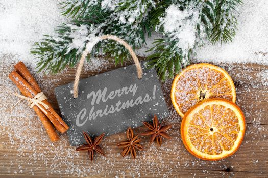 Christmas decoration with slate board, over wooden background