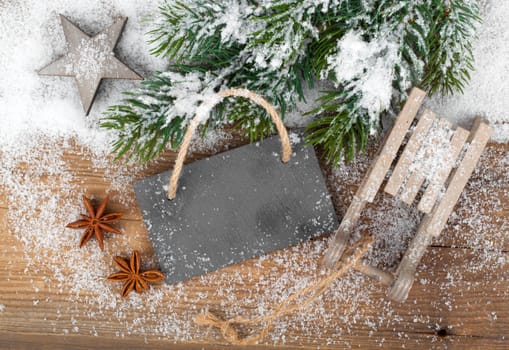 Christmas decoration over snow, wooden background