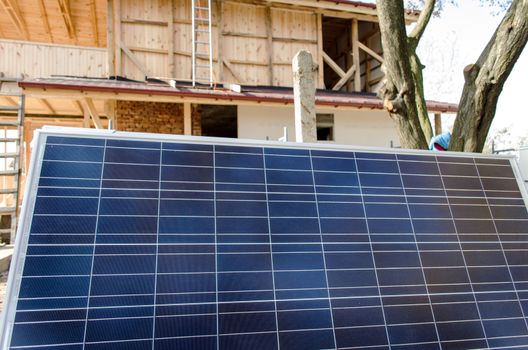 Solar photovoltaic panels mounted on a tiled house roof