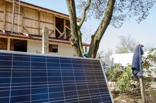 Solar photovoltaic panels mounted on a tiled house roof