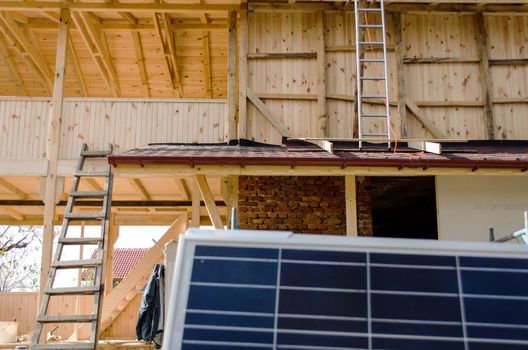 Solar photovoltaic panels mounted on a tiled house roof