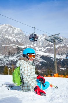 Ski, skier, winter - lovely girl has a fun on ski. Vertical view