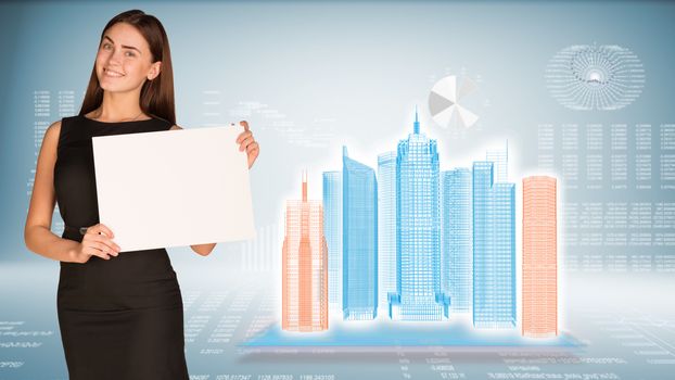 Businesswoman hold paper sheet. Wire-frame glowing buildings on transparent plane. Graphs as backdrop