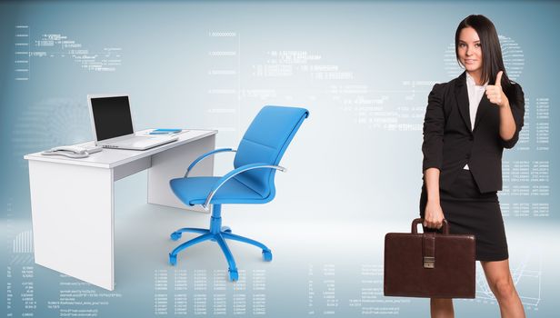 Businesswoman in suit holding briefcase and showing thumb-up. Office table with chair and open laptop are located next. Hi-tech graphs as backdrop