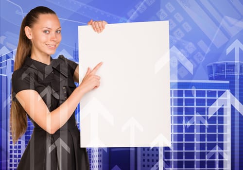 Beautiful businesswoman in dress smiling and holding empty paper sheet. Buildings and arrows as backdrop
