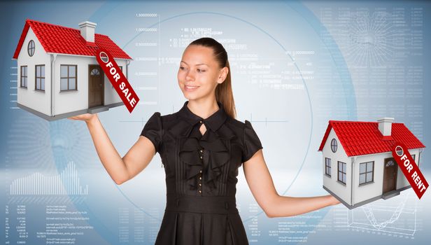 Businesswoman holding two house with tags for sale and rent. Hi-tech graphs as backdrop. Business concept