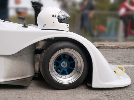 white racing helmet on racing car