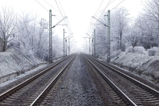 Railroad tracks in winter fog