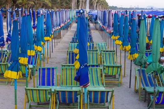 View of beach chair and umbrella on the beach