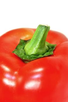 a section of a red bell pepper against a white background