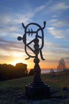 BONDI, AUSTRALIA -  OCTOBER 23, 2014; Sculpture by the Sea annual free public event 2014.  Sculpture titled Oceania Cartouche  by Jock Clutterbuck, VIC  Design iss based on Vanuatu sand drawings 