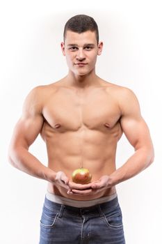 Fitness muscular man with apple - studio shoot 