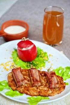 roast of veal meat with bacon with potatoes
