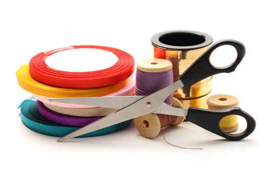 Thread bobbins, scissors and reels of ribbon