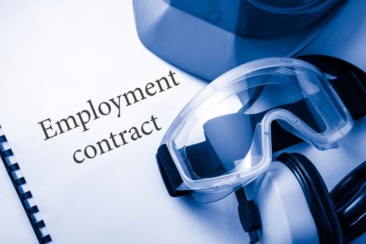 Employment contract with goggles, earphones and helmet