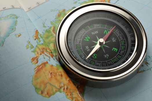 Compass on Earth map background