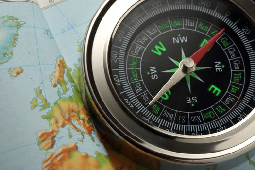 Compass on Earth map background
