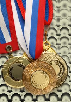 Metal medals on abstract bubble background