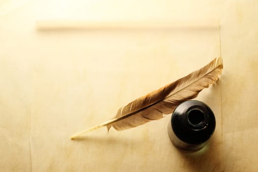 Blank envelope with inkwell and feather